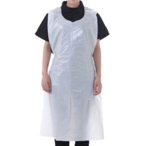 A lady wearing a white disposable apron